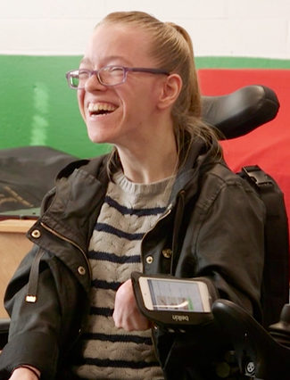 Music student Corrine plays the piano during a class by moving her arm. The attached iPod is connected wirelessly to the Music Kit. The music therapist can easily change the instrument, key, octave, music genre at any time during the class.