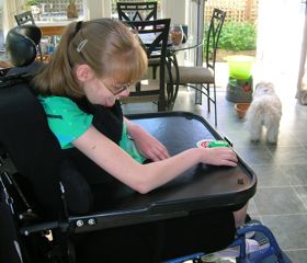 Shannon plays with Austin in her kitchen.