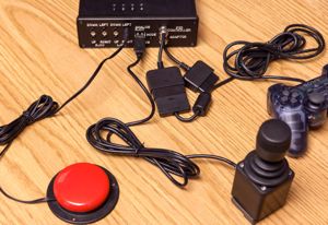 In this example, the controller is connected to a standard accessibility switch (the red button).