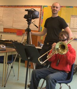 Josh tries out the new system with the help of Peter McGuire, one of CanAssist's electrical engineering team.